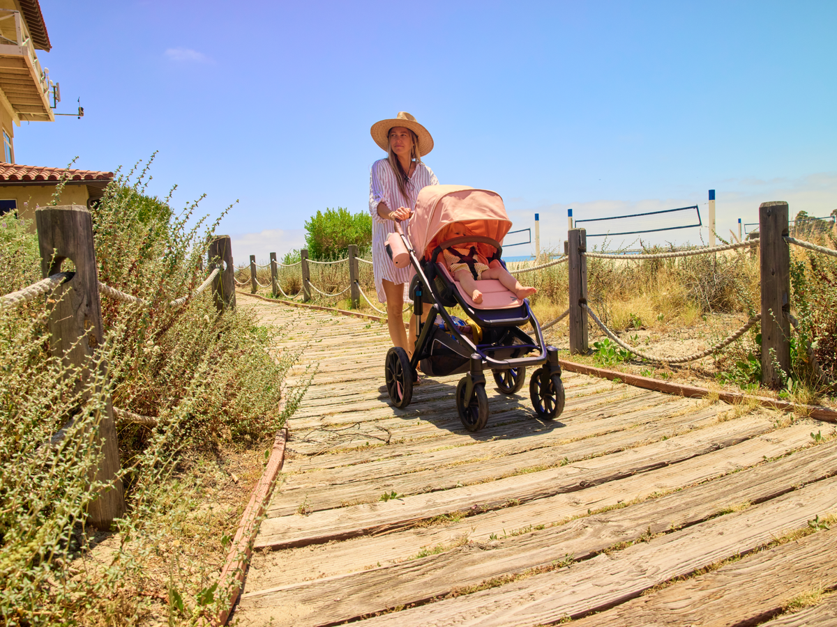 Family beside a Switch and Roll stroller